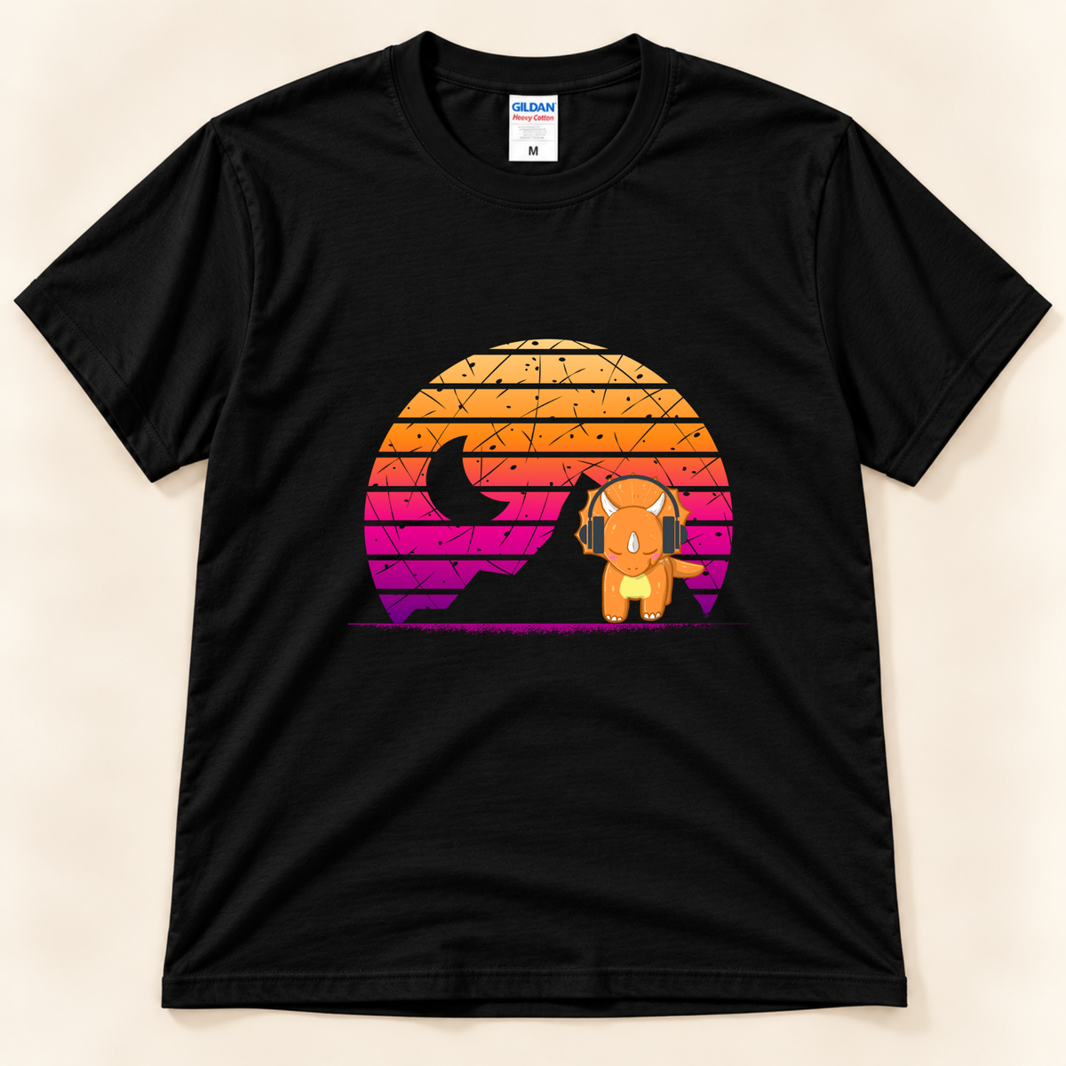 Black Gildan 5000 dinosaur graphic tee with a cute triceratops wearing headphones and a colorful retro sunset design from New Chapter Tees, a California small business.