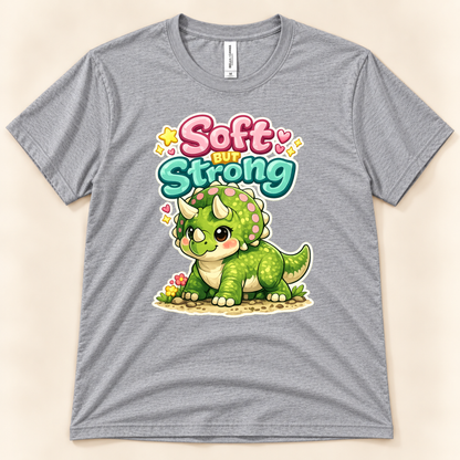 Soft But Strong cute triceratops graphic tee in Athletic Heather by New Chapter Tees, a California small business, with colorful dinosaur artwork.