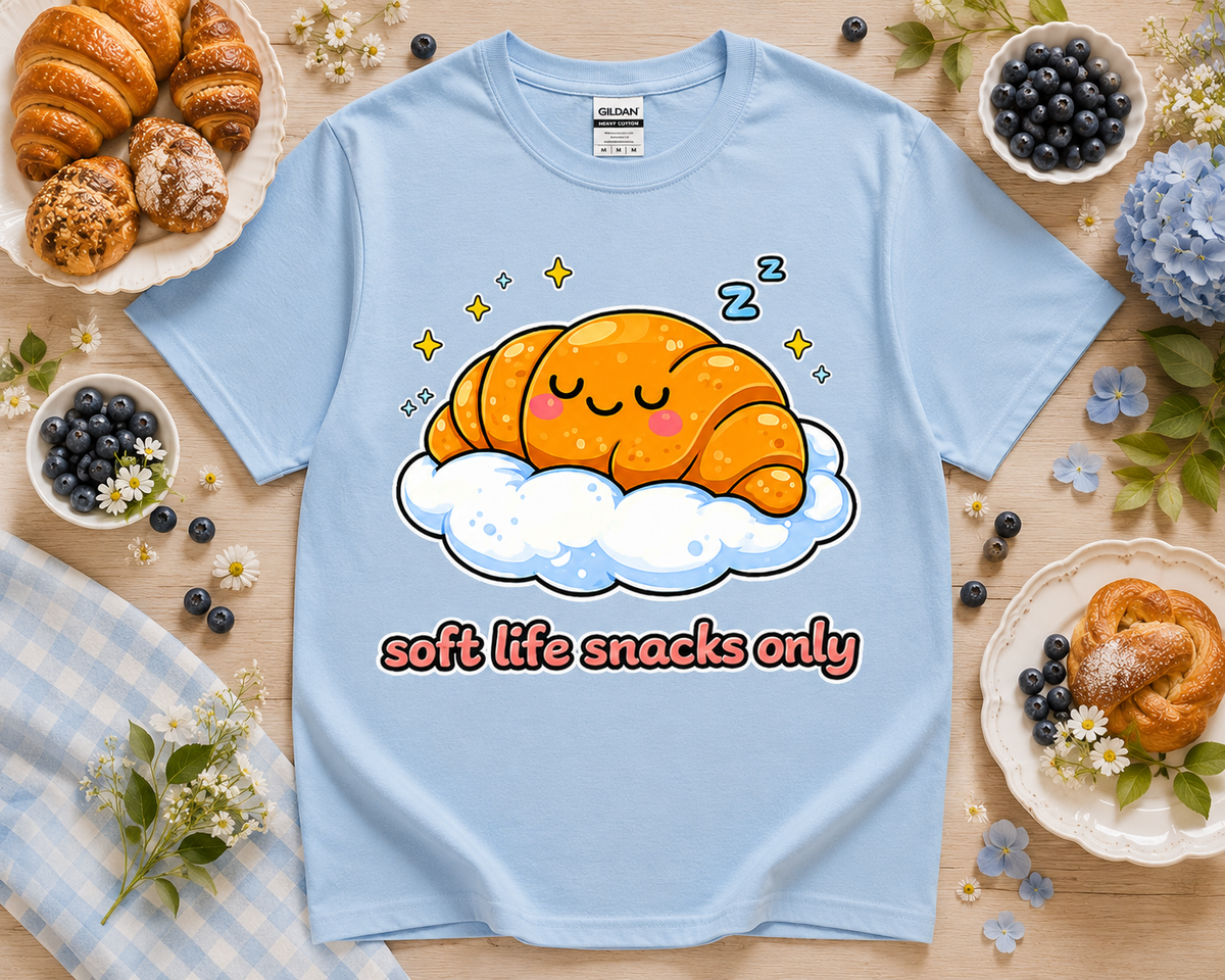 Light blue Gildan 5000 Soft Life Snacks Only cute croissant graphic tee by New Chapter Tees in California.