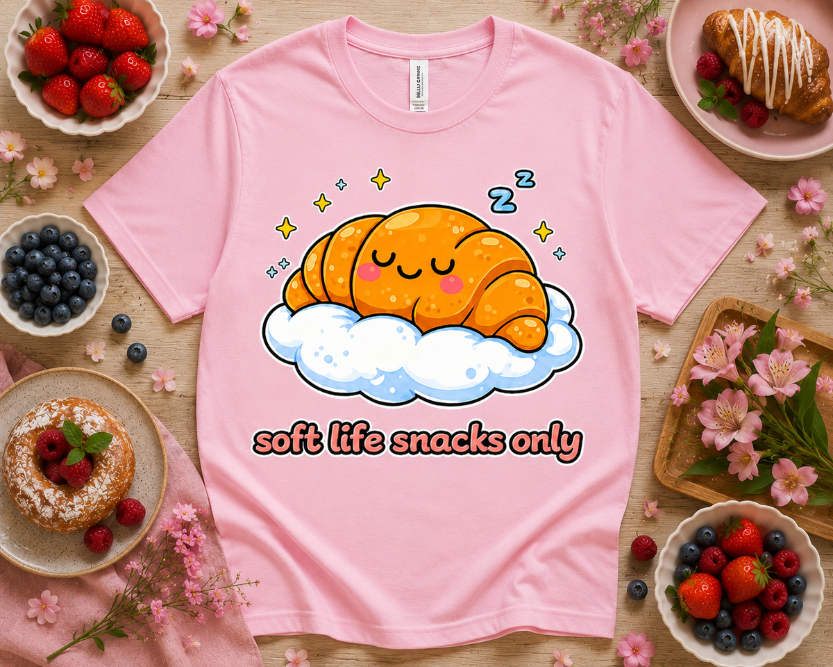 Pink Bella Canvas 3001 Soft Life Snacks Only cute croissant graphic tee with bakery flatlay