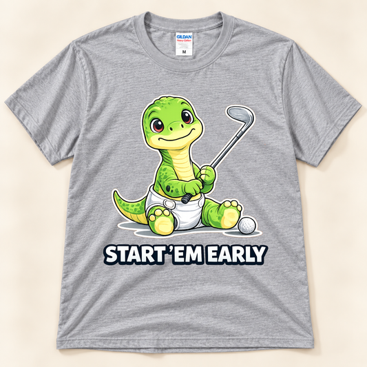 Sport Gray Gildan 5000 Start ’Em Early dinosaur golf tee featuring baby Brussel, a smiling green brontosaurus holding a golf club, from New Chapter Tees, a California small business.