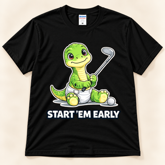 Black Gildan 5000 Start ’Em Early golf graphic tee featuring baby Brussel, a green brontosaurus holding a golf club with a golf ball, from New Chapter Tees, a California small business.