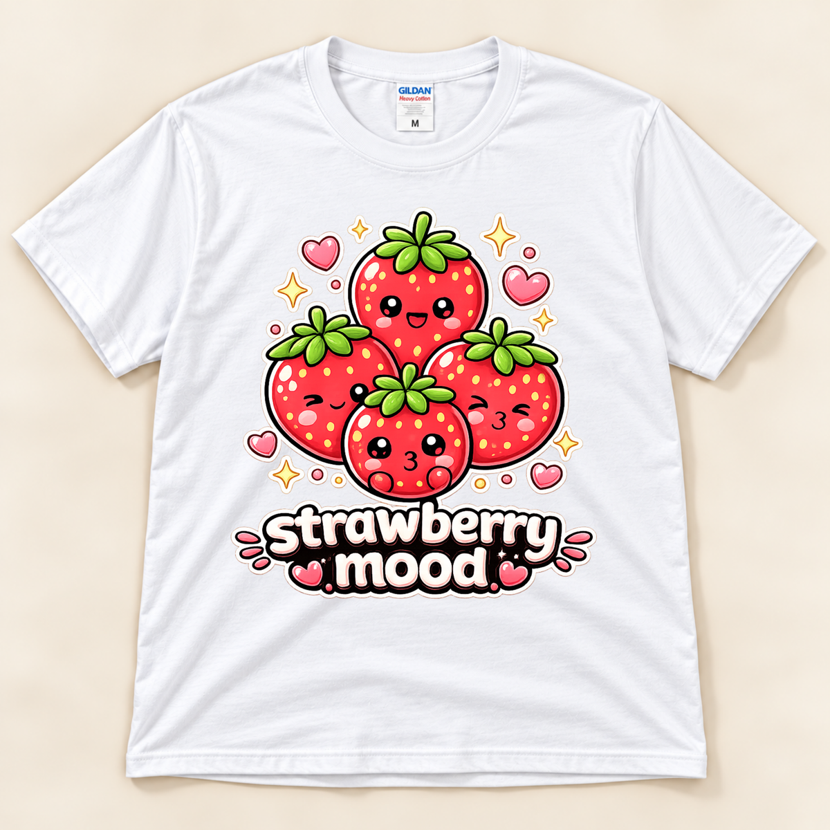 White Gildan 5000 kawaii strawberry graphic tee featuring four happy red strawberries with pink hearts, sparkles, and Strawberry Mood lettering from New Chapter Tees, a California small business.