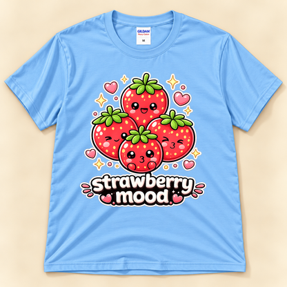 Carolina Blue Gildan 5000 kawaii fruit graphic tee featuring four adorable cartoon strawberries with cheerful expressions, hearts, sparkles, and Strawberry Mood lettering from New Chapter Tees, a California small business.