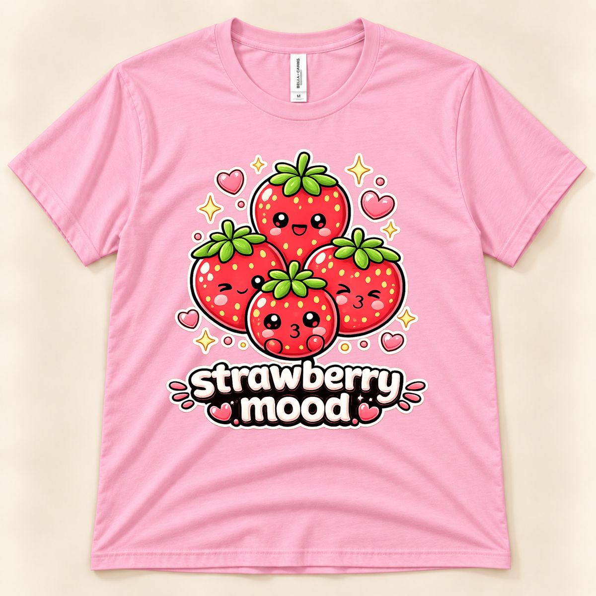 Pink Bella Canvas 3001 cute strawberry shirt featuring four kawaii red strawberries with green leaves, sweet expressions, pink hearts, and Strawberry Mood lettering from New Chapter Tees, a California small business.