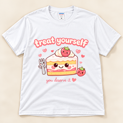 White Gildan 5000 strawberry cake graphic tee featuring a smiling kawaii cake slice, adorable fork, pink hearts and Treat Yourself You Deserve It lettering from New Chapter Tees, a California small business.