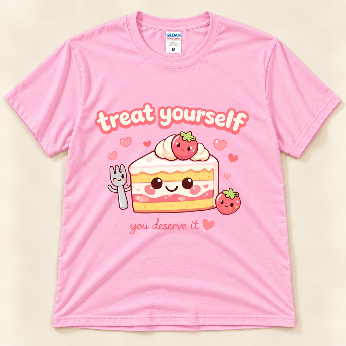 Light Pink Gildan 5000 Treat Yourself You Deserve It shirt featuring a kawaii strawberry cake slice with smiling face, cute fork, strawberries and pink hearts from New Chapter Tees, a California small business.