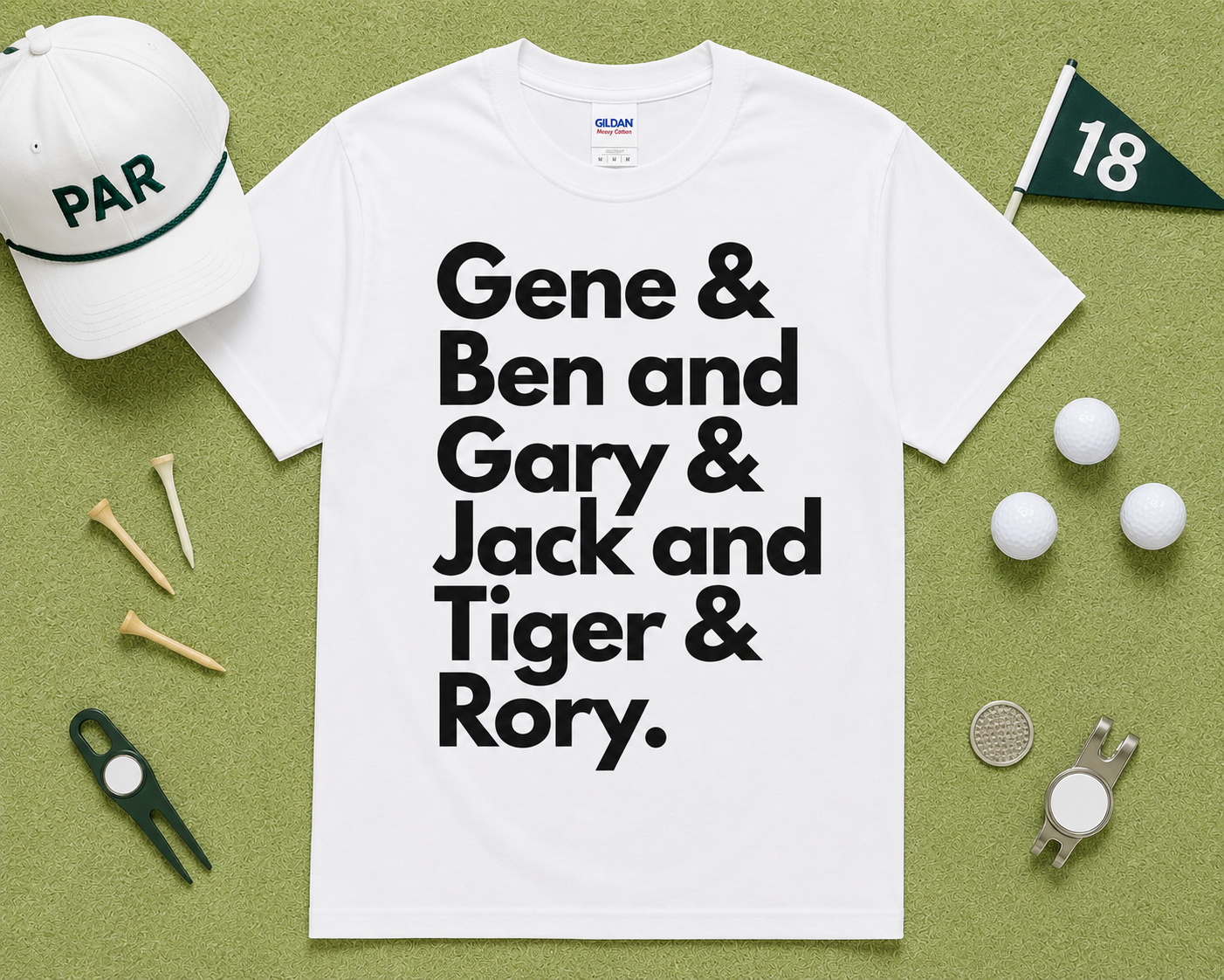 White Gildan 5000 golf graphic t shirt flatlay featuring Gene Ben Gary Jack Tiger Rory design with golf accessories on light green grass, funny golfer gift, unisex golf apparel, USA golf lifestyle clothing.