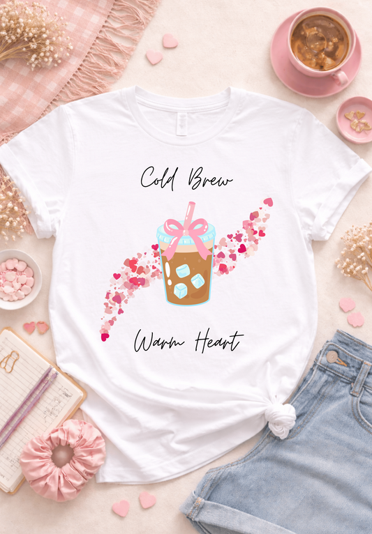 Cold brew warm heart coffee graphic tee flatlay, cute iced coffee shirt aesthetic with pink hearts design