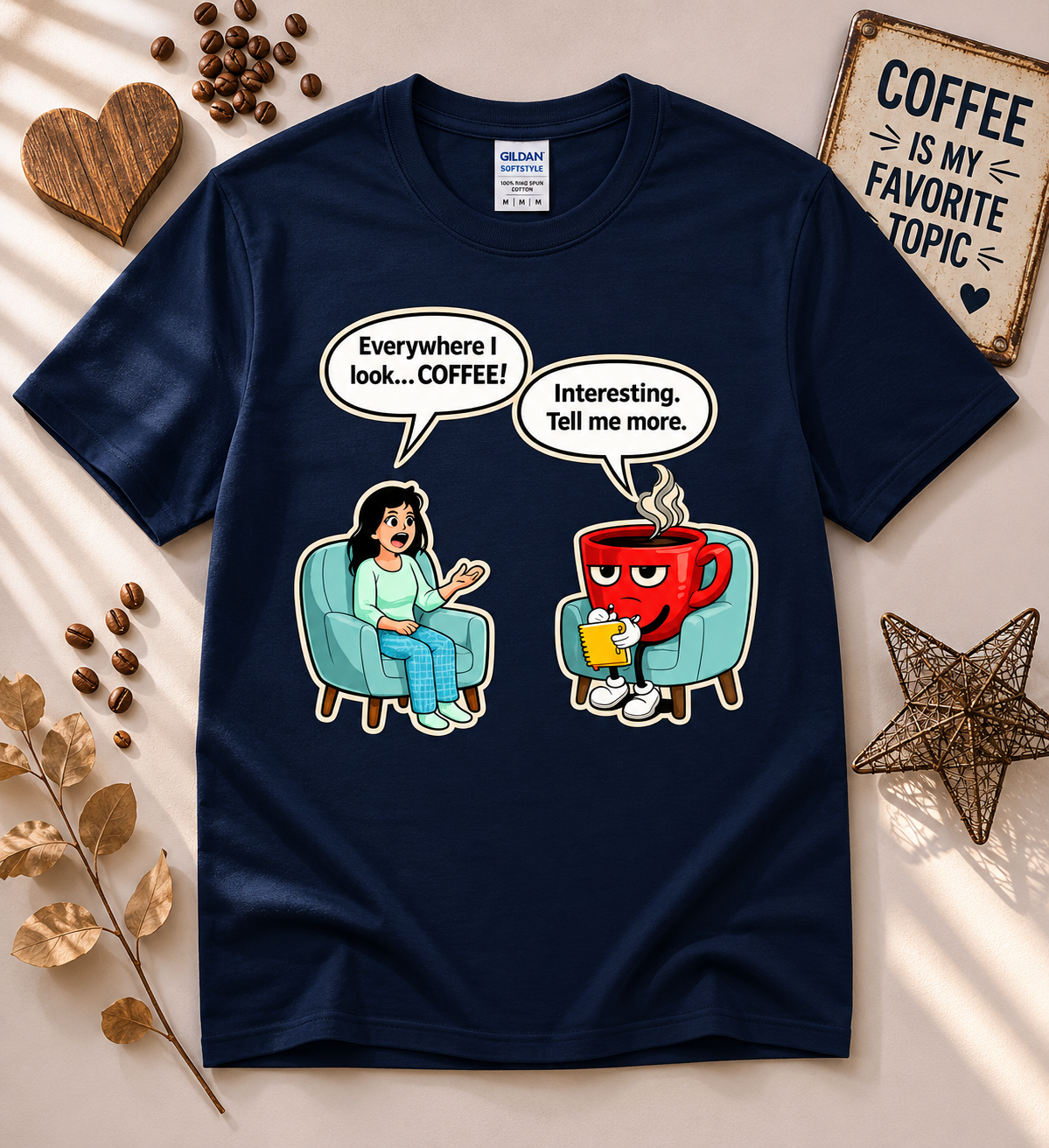 Funny coffee lover graphic tee in navy featuring a therapy session cartoon with a coffee addict saying everywhere I look coffee and a coffee cup therapist responding tell me more, humorous caffeine lover shirt from New Chapter Tees.