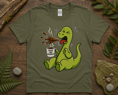 Funny coffee dinosaur graphic tee on military green Gildan shirt with cute caffeinated dino design and cozy earthy flat lay styling