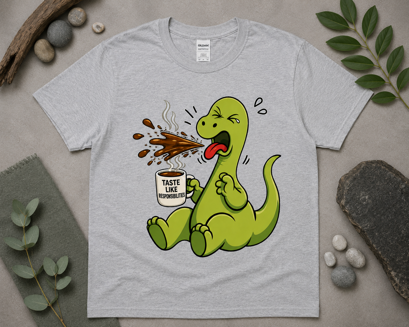Funny coffee dinosaur graphic tee on sport grey Gildan shirt with cozy relaxed styling and caffeine humor design