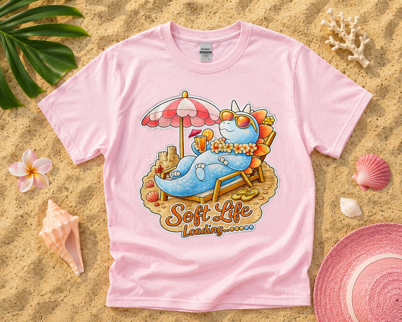 Soft Life Stegosaurus dinosaur graphic tee on light pink Gildan shirt featuring tropical beach flatlay for soft life summer fashion