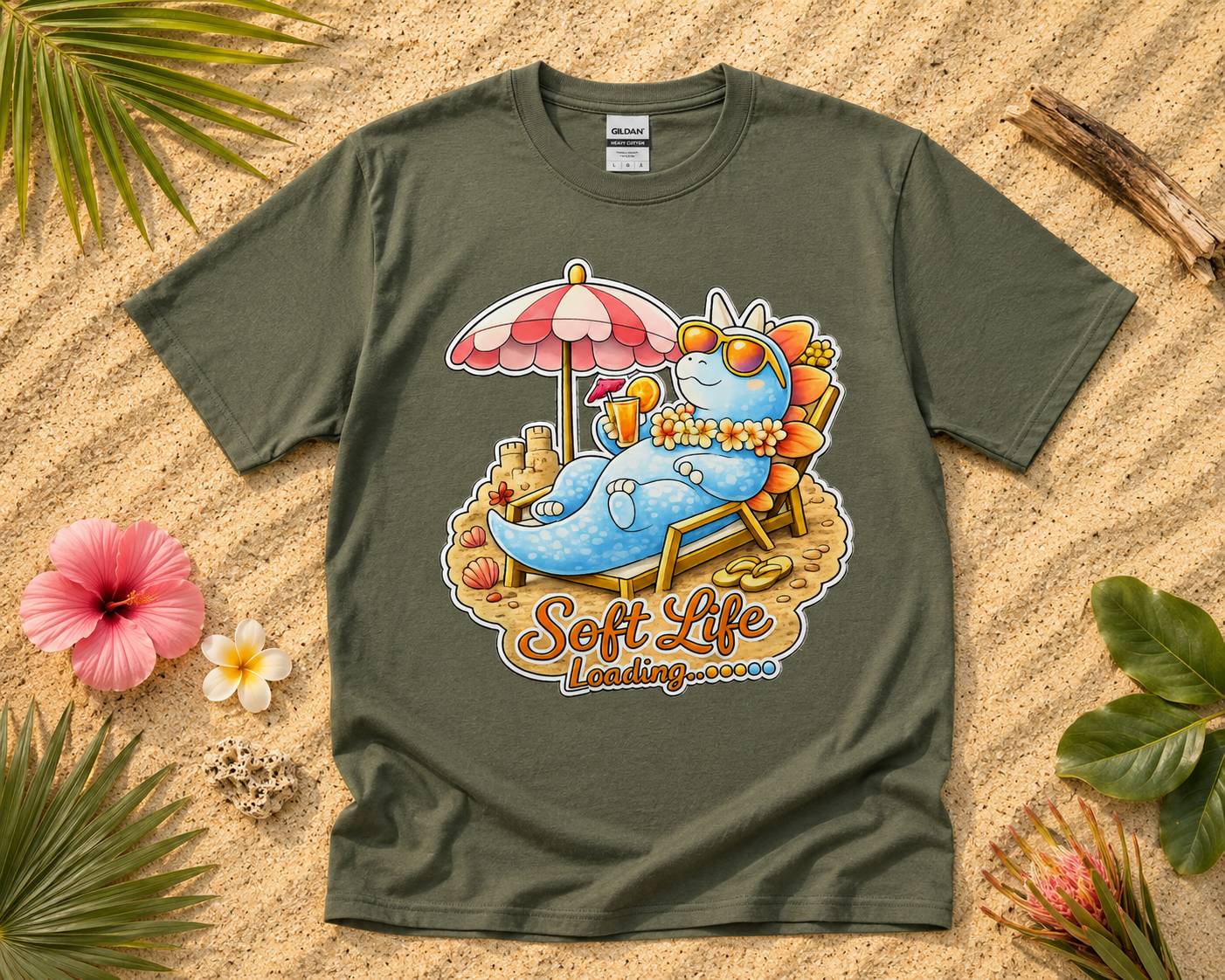 Soft Life Stegosaurus dinosaur graphic tee on military green Gildan shirt with tropical beach vacation flatlay relaxing dinosaur apparel