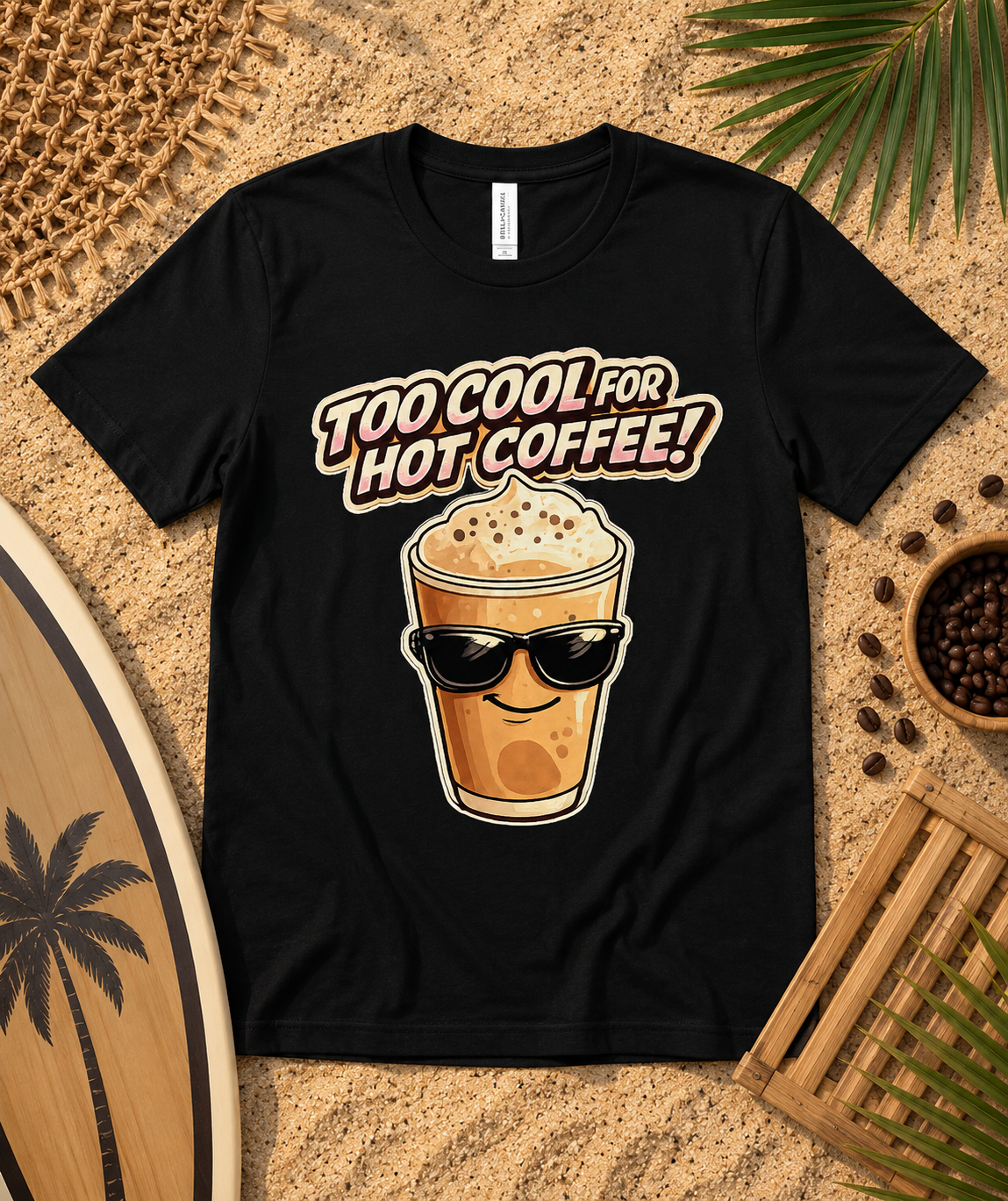 Black Bella Canvas 3001 Too Cool For Hot Coffee premium soft graphic tee flat lay with sandy beach coffee accessories iced coffee lover shirt USA