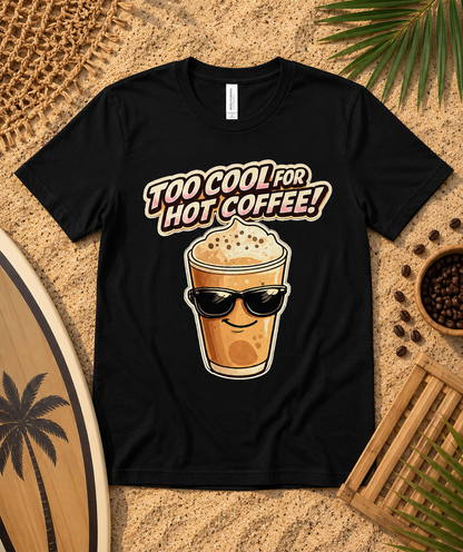 Black Bella Canvas 3001 Too Cool For Hot Coffee premium soft graphic tee flat lay with sandy beach coffee accessories iced coffee lover shirt USA