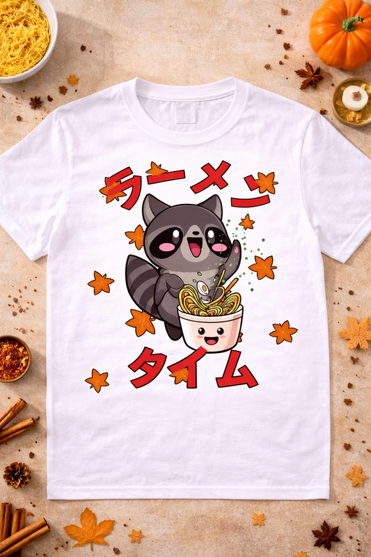 White anime ramen shirt with kawaii raccoon design and fall leaves, cute Japanese foodie graphic tee flatlay