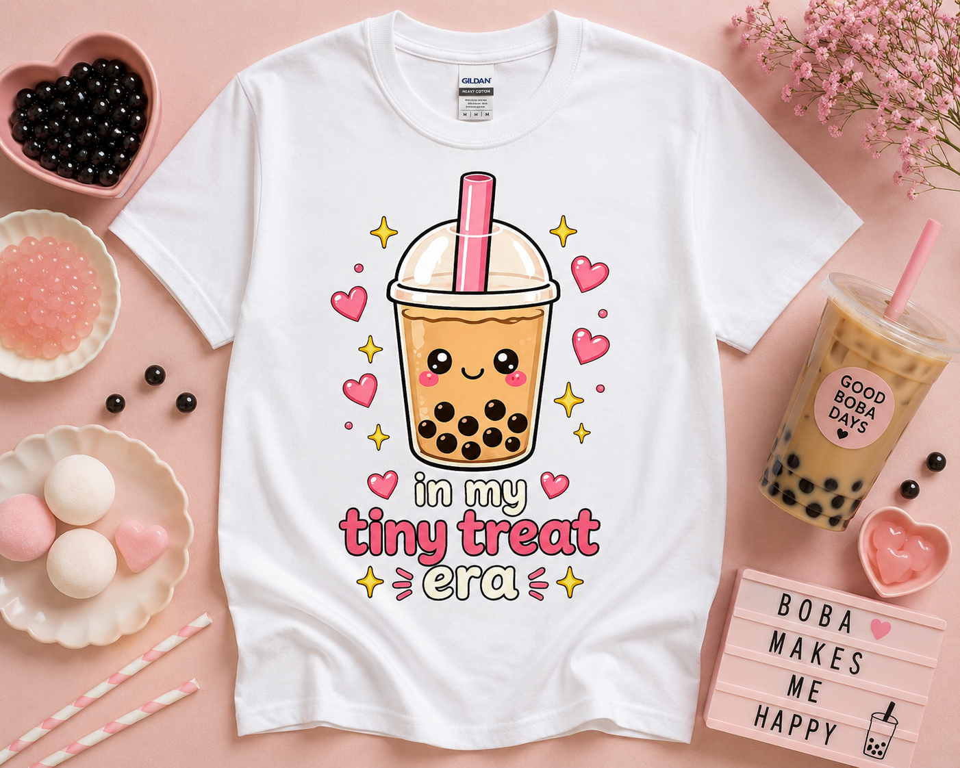 White kawaii boba tea shirt with tiny treat era saying and pastel pink bubble tea artwork styled in cute café inspired flat lay aesthetic for women teens and soft girl fashion lovers